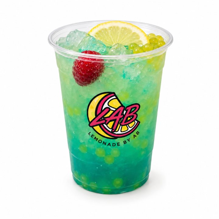 Blue-green lemonade with popping boba and raspberry